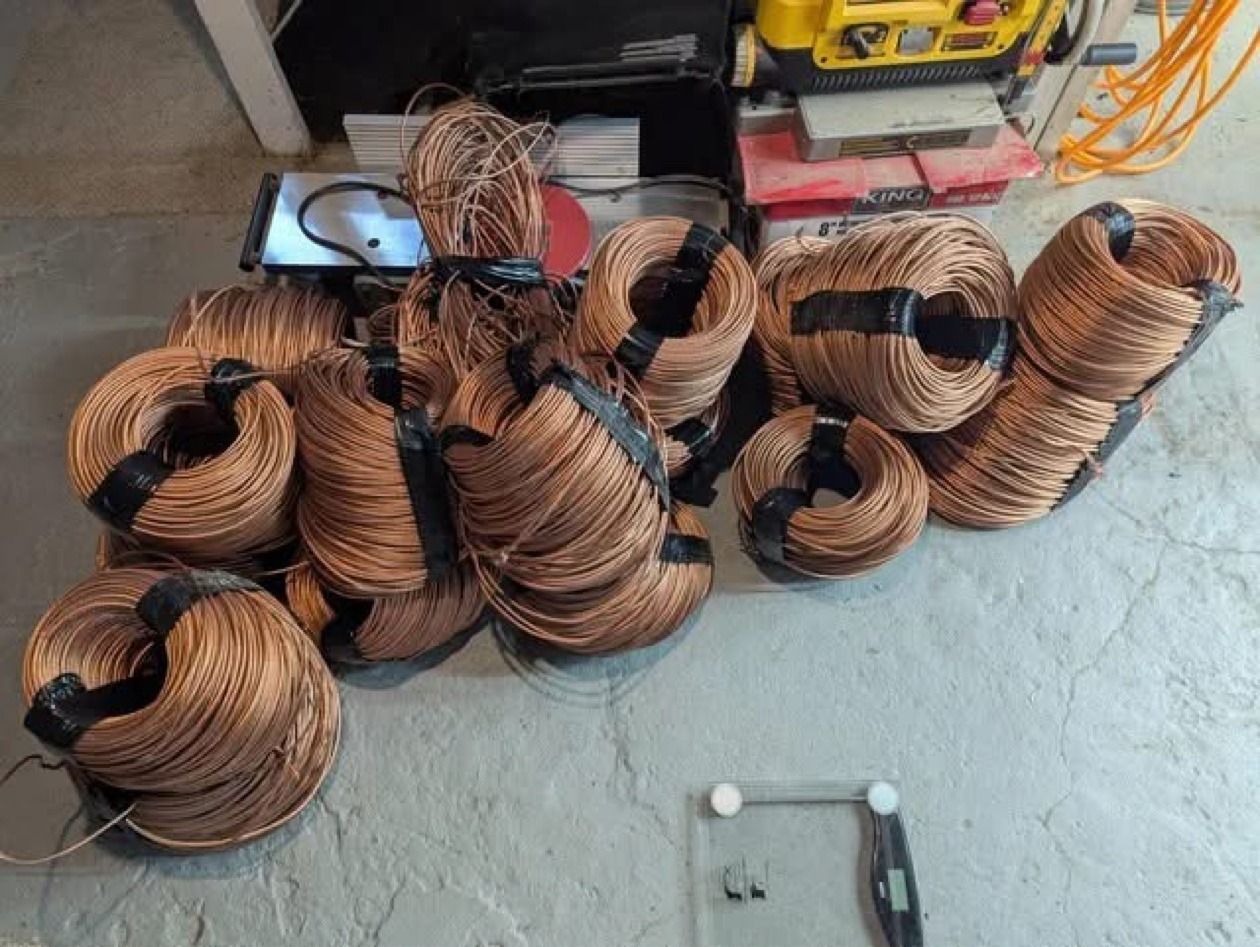 Taped coils of stripped bare bright copper wire