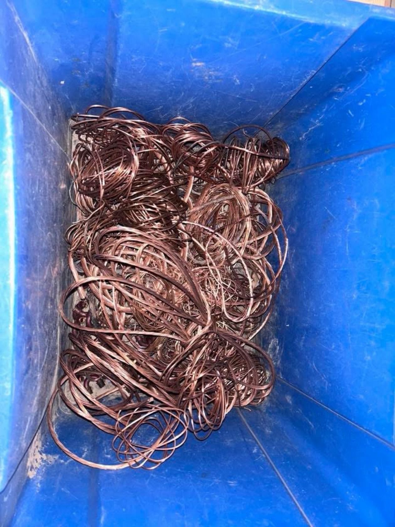Blue bin of fine stripped copper hair wire
