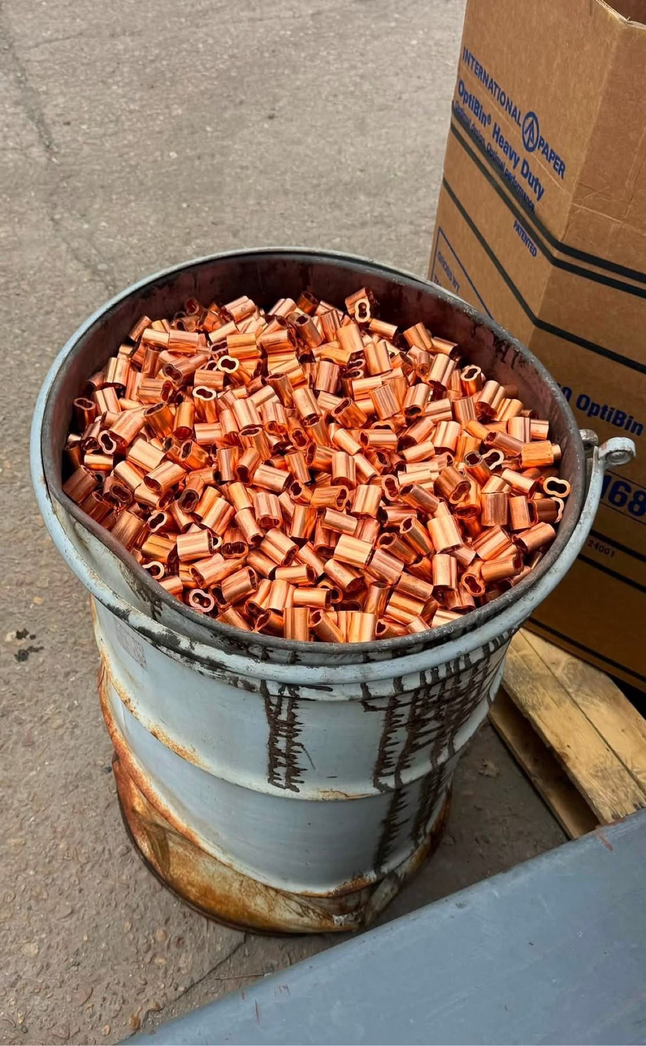 Drum of clean copper crimp sleeves and compression lugs