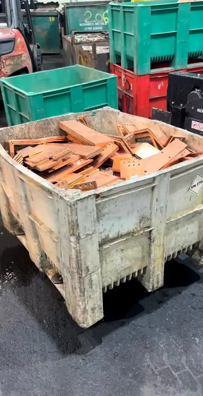 Crate of copper bus bar pieces