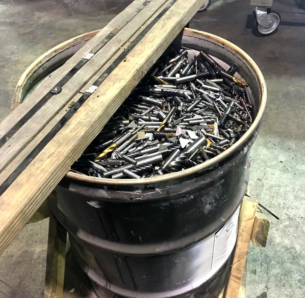 Barrel of used carbide drill bits bought for scrap