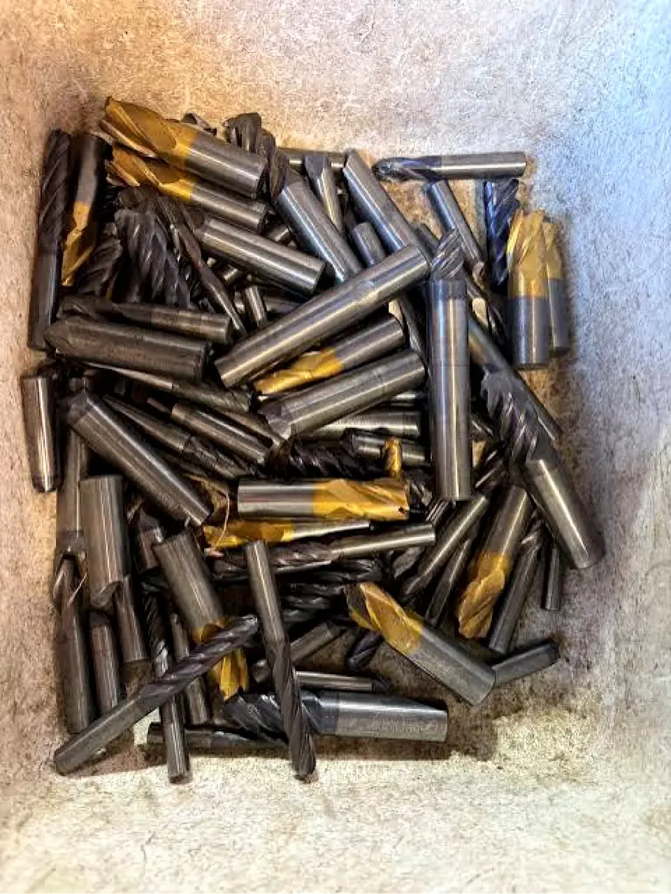 Tote of used end mills