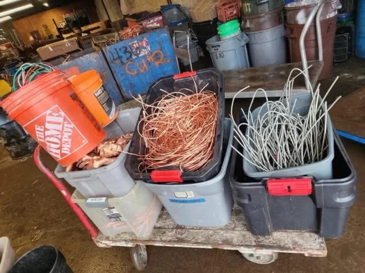 Bins of sorted copper on a cart