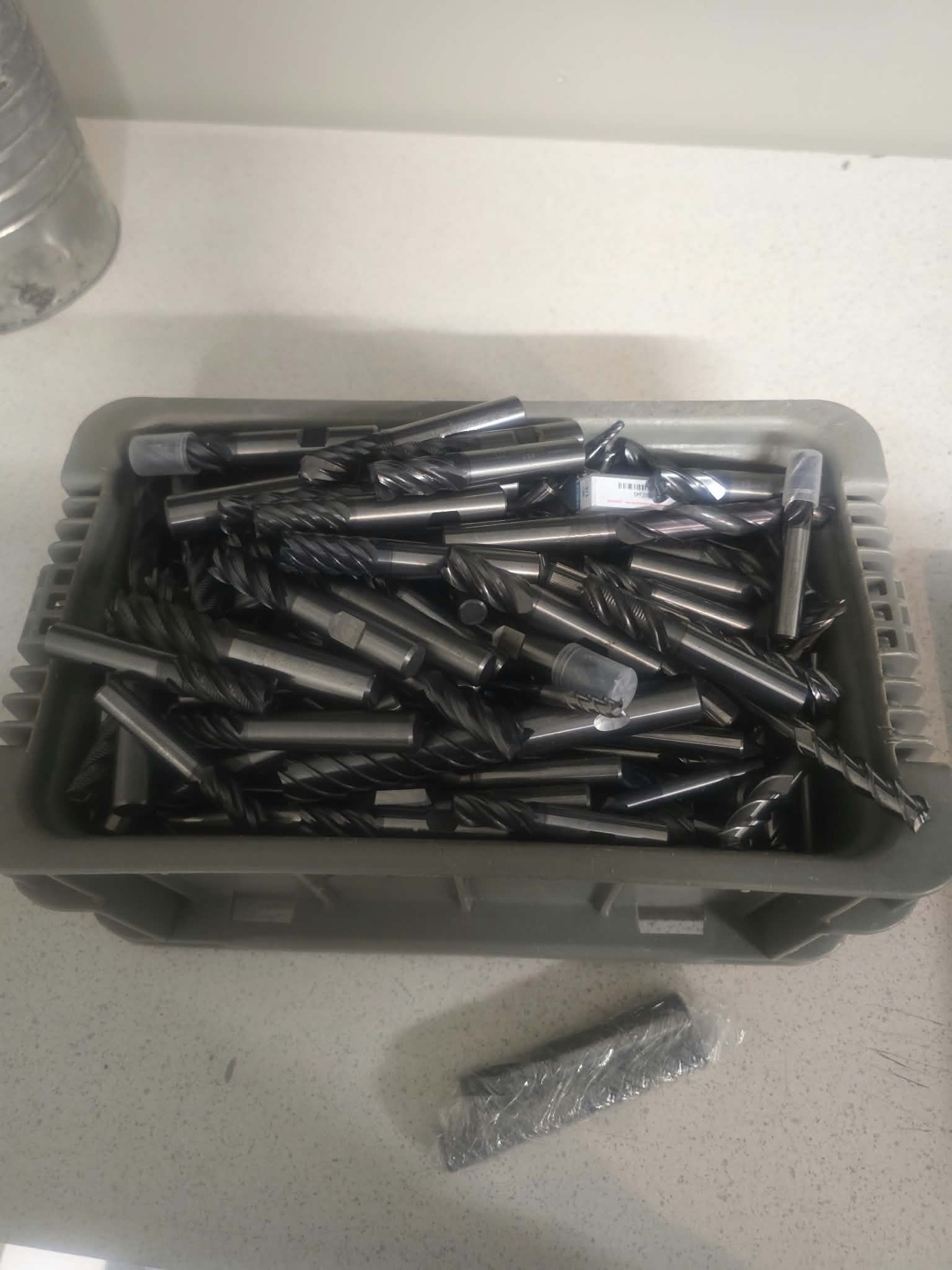 Bin of used solid-carbide end mills